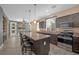 Modern kitchen with granite countertops, stainless steel appliances, and large island with seating at 3441 Mountain Park St, Las Vegas, NV 89129