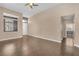 Bright living room featuring hardwood floors, neutral paint, lots of natural light and modern ceiling fan at 3441 Mountain Park St, Las Vegas, NV 89129