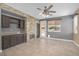Inviting living space featuring a stone accent wall with a fireplace, tile flooring, and recessed lighting at 3441 Mountain Park St, Las Vegas, NV 89129