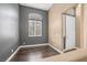 Stylish living room showcasing dark wood flooring, a large window, and neutral wall colors at 3441 Mountain Park St, Las Vegas, NV 89129