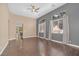 Spacious living room featuring hardwood floors, neutral paint, lots of natural light and modern ceiling fan at 3441 Mountain Park St, Las Vegas, NV 89129