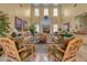 Relaxing lobby with comfortable couches, a fireplace, and views of outdoor greenery at 3441 Mountain Park St, Las Vegas, NV 89129