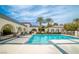Sparkling pool offers a refreshing escape with lovely landscaping and palm trees nearby at 3441 Mountain Park St, Las Vegas, NV 89129