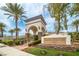 Elegant entrance to Shadow Hills Club, featuring beautiful landscaping and stone accents at 3441 Mountain Park St, Las Vegas, NV 89129