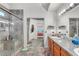 Well-lit bathroom with double sinks, vanity, and a glass-enclosed shower at 3536 Golden Pedal St, Las Vegas, NV 89129