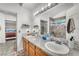 Modern bathroom with double sinks, vanity, and glass shower at 3536 Golden Pedal St, Las Vegas, NV 89129