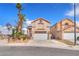 Charming two-story home featuring a two-car garage, landscaped front yard, and stucco exterior at 3536 Golden Pedal St, Las Vegas, NV 89129