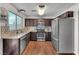 Well-equipped kitchen featuring stainless steel appliances, granite countertops, and hardwood floors at 3536 Golden Pedal St, Las Vegas, NV 89129