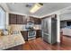 Modern kitchen with stainless steel appliances, granite countertops, and ample cabinet space at 3536 Golden Pedal St, Las Vegas, NV 89129