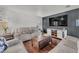 Comfortable living room with plush sofas, a wooden coffee table, and an entertainment center at 3536 Golden Pedal St, Las Vegas, NV 89129