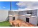 Outdoor kitchen with sink, grill, and tiled backsplash, perfect for entertaining at 3536 Golden Pedal St, Las Vegas, NV 89129
