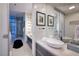 Modern bathroom featuring dual vessel sinks, sleek cabinets, and artistic mirrors that create sophisticated retreat at 3726 S Las Vegas Blvd # 1107, Las Vegas, NV 89158