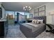 Modern bedroom with city view, stylish chandelier, and unique carpet at 3726 S Las Vegas Blvd # 1107, Las Vegas, NV 89158