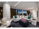 Bright living room featuring a gray sectional sofa with colorful pillows and large windows overlooking the city at 3726 S Las Vegas Blvd # 1107, Las Vegas, NV 89158