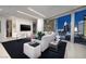 Modern living room featuring floor to ceiling windows with stunning city views and a large sectional sofa at 3726 S Las Vegas Blvd # 1107, Las Vegas, NV 89158