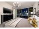 Bright bedroom boasts city views, a modern chandelier, and sleek black dresser for a stylish, comfortable retreat at 3726 S Las Vegas Blvd # 1107, Las Vegas, NV 89158