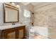 Traditional bathroom with a wooden vanity, decorative mirror, and a tiled shower-over-tub at 3789 Gershon Ct, Las Vegas, NV 89121