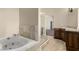 Bright bathroom featuring a built in jacuzzi bathtub, vanity and walk in shower at 3789 Gershon Ct, Las Vegas, NV 89121