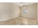Cozy bedroom featuring neutral walls, tile flooring, and a ceiling fan at 3789 Gershon Ct, Las Vegas, NV 89121