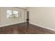 Bedroom with a dark hardwood floors and a window with a view of the neighborhood at 3789 Gershon Ct, Las Vegas, NV 89121
