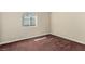 Bedroom with a window letting in natural light and brown carpeted floors at 3789 Gershon Ct, Las Vegas, NV 89121
