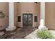 Elegant entrance featuring double doors, stately pillars, and decorative stone pathway at 3789 Gershon Ct, Las Vegas, NV 89121