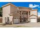 Elegant two-story home featuring a brick driveway, three-car garage, and a desert front yard at 3789 Gershon Ct, Las Vegas, NV 89121