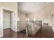 Bright hallway featuring hardwood floors and ornamental iron railing at 3789 Gershon Ct, Las Vegas, NV 89121