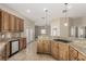 Charming kitchen with granite countertops, wooden cabinets, and stainless steel appliances at 3789 Gershon Ct, Las Vegas, NV 89121