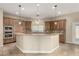 Modern kitchen featuring a large island, stainless steel appliances, and custom wood cabinets at 3789 Gershon Ct, Las Vegas, NV 89121
