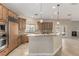 Elegant kitchen featuring granite countertops, modern appliances, and wooden cabinets at 3789 Gershon Ct, Las Vegas, NV 89121