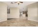 Spacious living room with tile flooring that seamlessly connects to an open-concept kitchen at 3789 Gershon Ct, Las Vegas, NV 89121