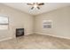 Inviting living room with a cozy fireplace, ceiling fan and tile floors at 3789 Gershon Ct, Las Vegas, NV 89121