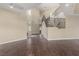 Bright living room featuring high ceilings, wood floors, and a modern staircase at 3789 Gershon Ct, Las Vegas, NV 89121