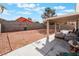 Expansive backyard with a covered patio, perfect for outdoor gatherings at 3812 Blue Dawn Dr, North Las Vegas, NV 89032