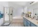 Bright bathroom with a soaking tub and a glass shower enclosure at 3812 Blue Dawn Dr, North Las Vegas, NV 89032