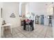 Spacious dining area featuring tile flooring, a fireplace, and access to multiple rooms at 3812 Blue Dawn Dr, North Las Vegas, NV 89032