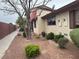 Building exterior showcasing well-maintained landscaping and red rock ground cover at 3934 Torsby Pl, Las Vegas, NV 89119