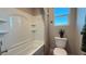 Bright bathroom with shower-tub combo and modern fixtures at 4181 Nopal Serrano Ave, Las Vegas, NV 89141