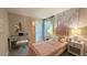Charming bedroom with pink decor, floral wallpaper, and a cozy, inviting atmosphere at 4181 Nopal Serrano Ave, Las Vegas, NV 89141