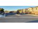 Community entrance featuring decorative gates and landscaped median at 4181 Nopal Serrano Ave, Las Vegas, NV 89141