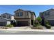 Charming two-story home featuring a two-car garage, desert landscaping, and a welcoming front entryway at 4181 Nopal Serrano Ave, Las Vegas, NV 89141