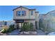 Charming two-story home with stone accents, covered entry, and well-maintained landscaping at 4181 Nopal Serrano Ave, Las Vegas, NV 89141