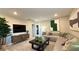 Comfortable living room featuring a modern sectional sofa, sleek furniture, and stylish decor at 4181 Nopal Serrano Ave, Las Vegas, NV 89141