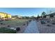 Community park featuring shaded seating areas, lush landscaping, and walking paths at 4181 Nopal Serrano Ave, Las Vegas, NV 89141