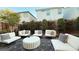 Stylish outdoor patio with modern furniture, decorative pillows, and a cozy atmosphere at 4181 Nopal Serrano Ave, Las Vegas, NV 89141