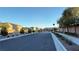 Wide community street with landscaped sidewalks and well-maintained homes at 4181 Nopal Serrano Ave, Las Vegas, NV 89141