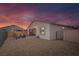 Home backyard with a patio, seating area, gravel landscaping, and block wall at 4315 E Cactus Canyon Dr, Pahrump, NV 89061