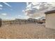 Expansive backyard with modern landscaping, featuring a barbecue area and desert rock at 4315 E Cactus Canyon Dr, Pahrump, NV 89061