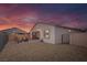 An outdoor patio area with patio furniture, a rock yard, string lights and a block wall at 4315 E Cactus Canyon Dr, Pahrump, NV 89061